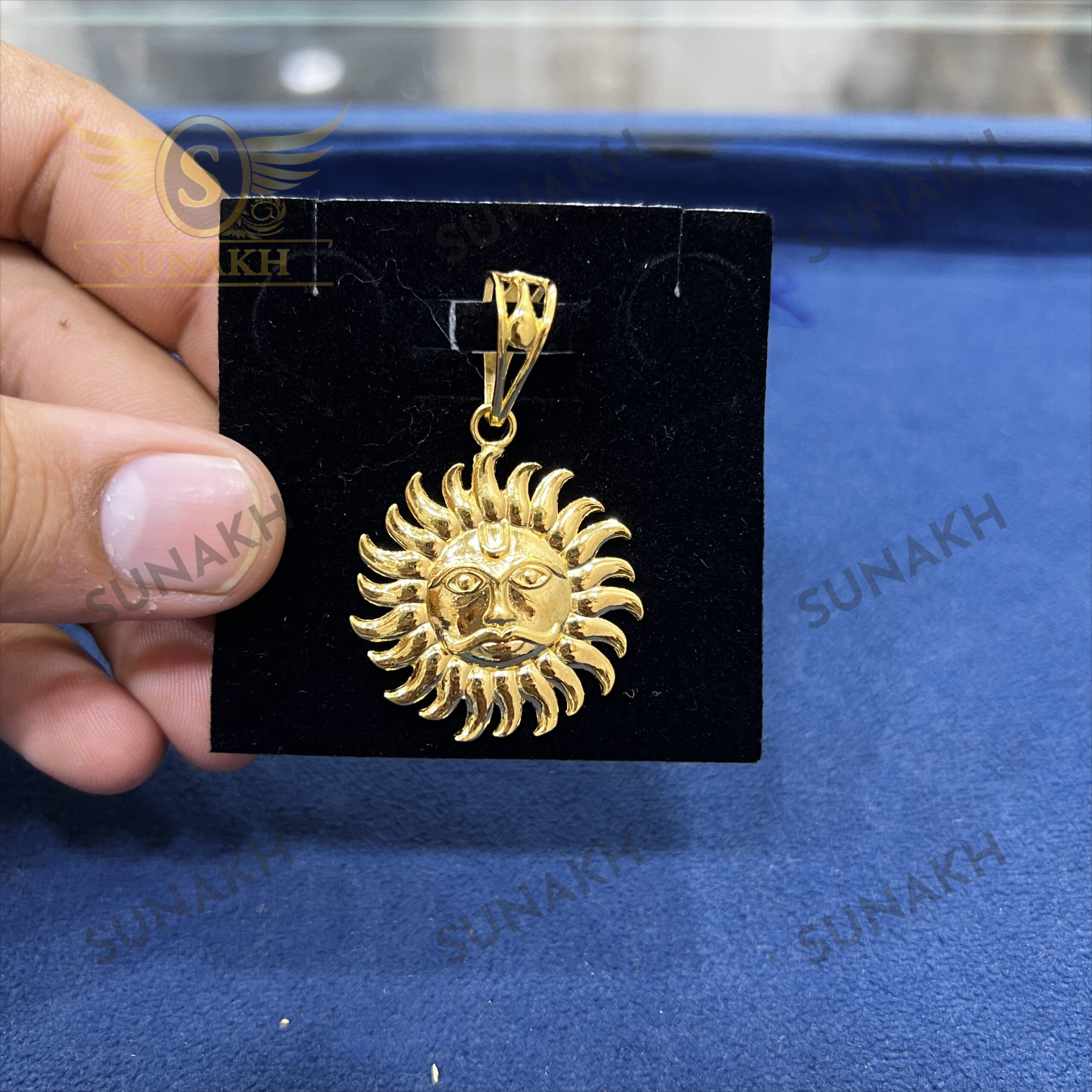 GOLD TONED SUNBURST PENDANT WITH CENTRAL SYMBOL - Image 2