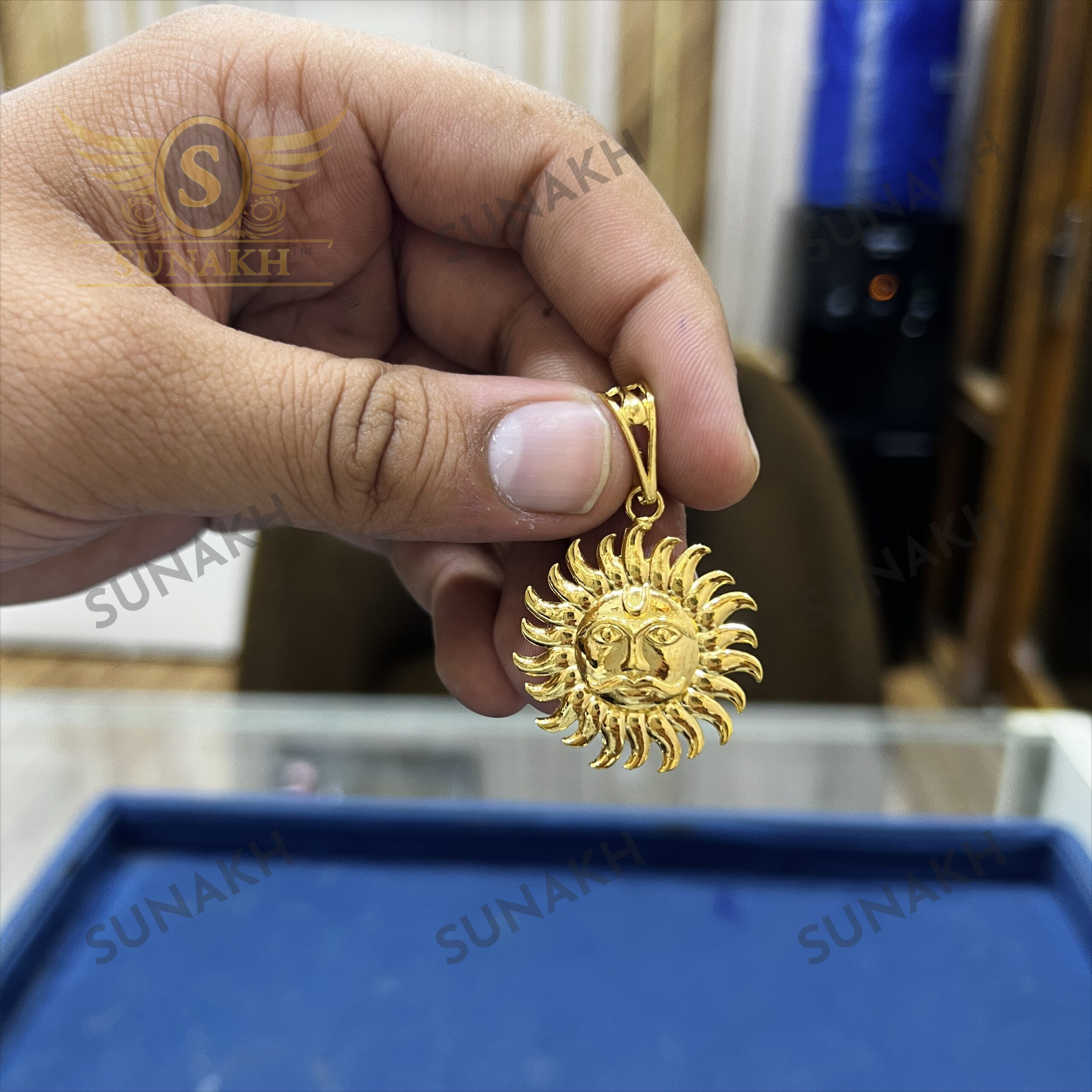 GOLD TONED SUNBURST PENDANT WITH CENTRAL SYMBOL - Image 3