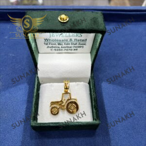GOLD TRACTOR PENDANT