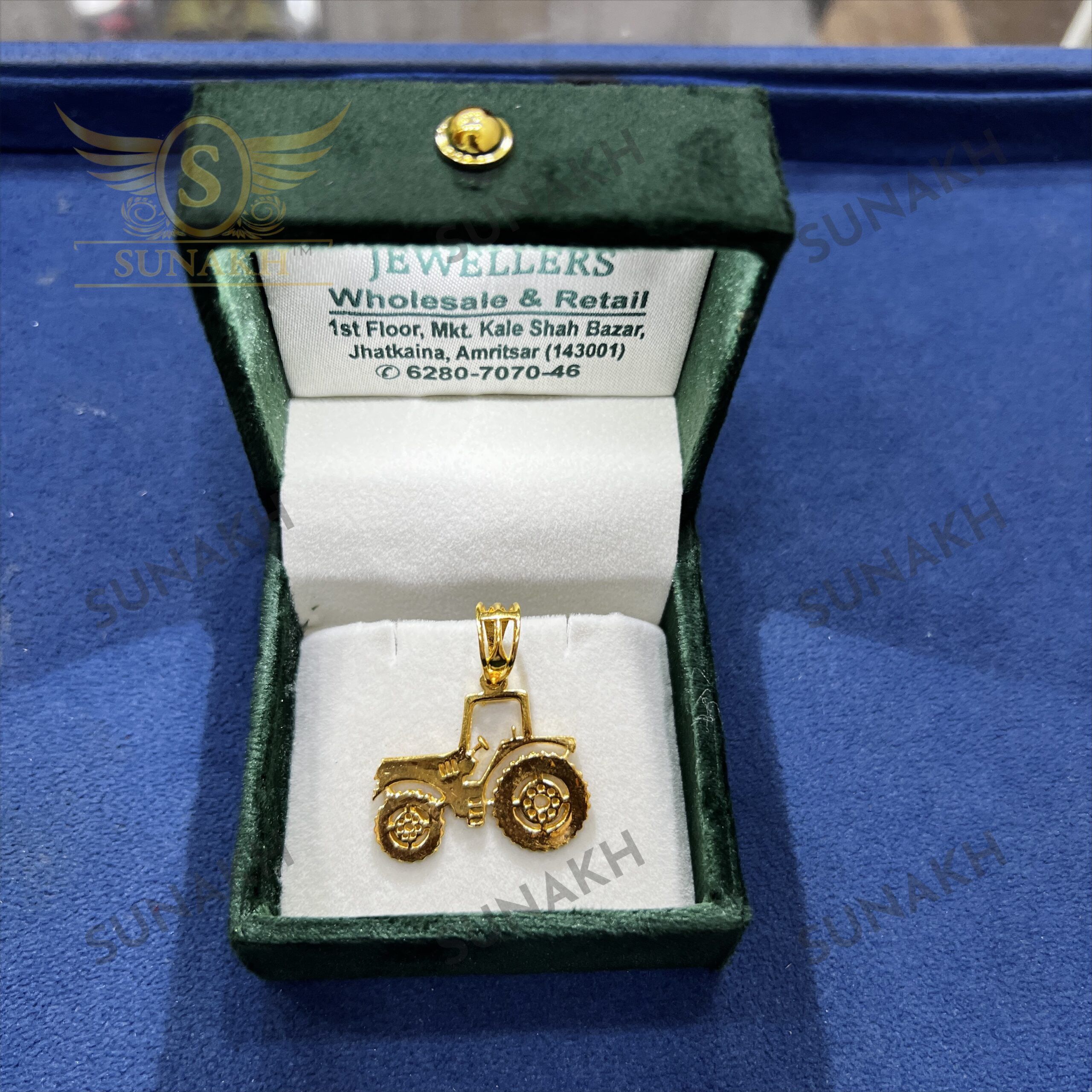GOLD TRACTOR PENDANT